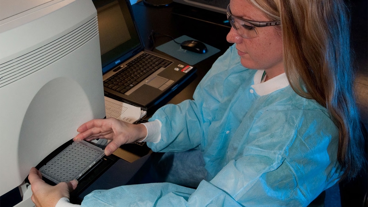 APHIS employee working in a lab