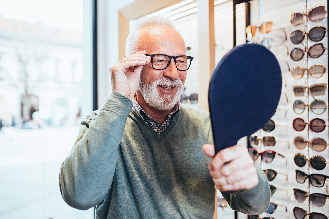 man trying on a pair of glasses